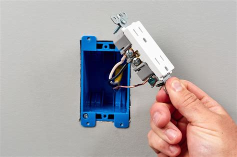 parts of an electrical outlet box|inside of electrical outlet.